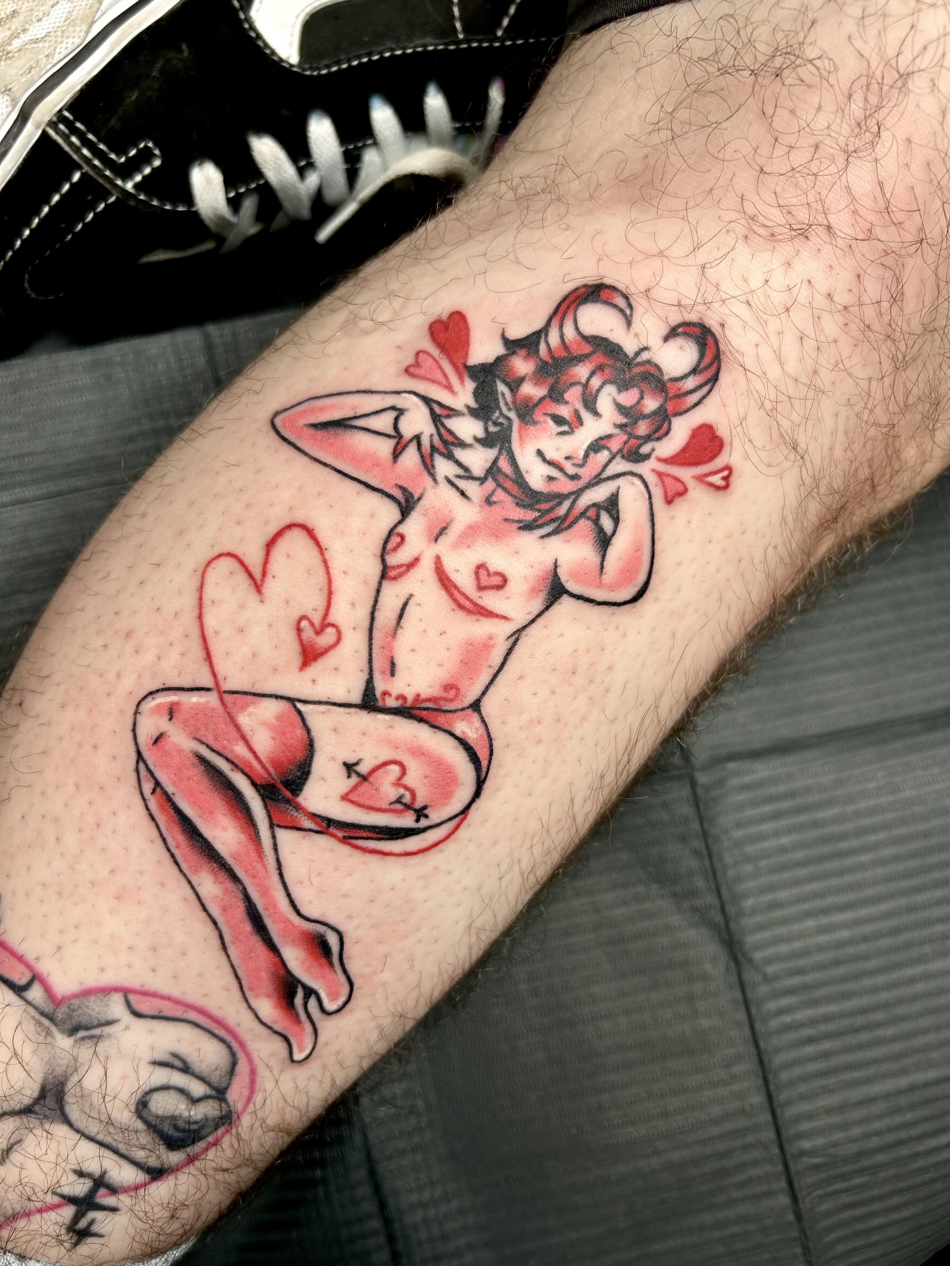 Devil pinup with hearts tattoo by Leo Gielow who works at Resilience Body Arts in Maynard, MA